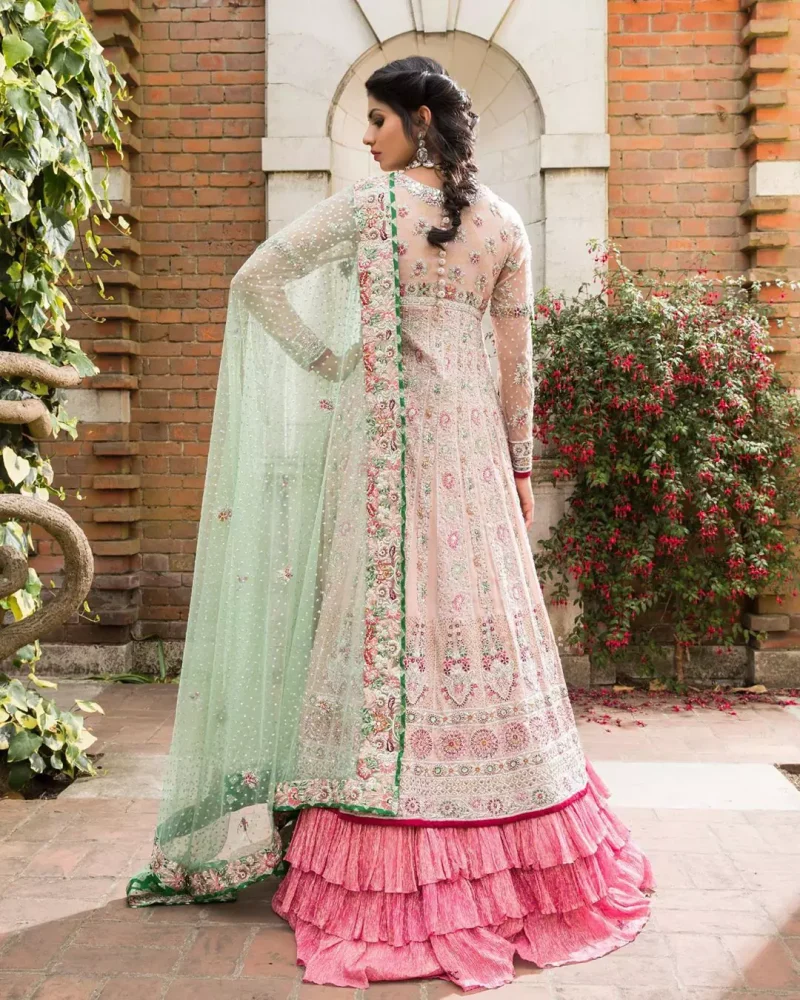 Opt for our ivory multiple-panel anarkali dress with exquisite embellishment on the bodice with pearls, sequins and silver kora, dabka. The daaman comprises of borders highlighted with floral embellished pattern. It is finished with deep blush frilled lehengha which adds to the bling. Dupatta is allured with four sided embellished border and sprinkled with stones all over it.