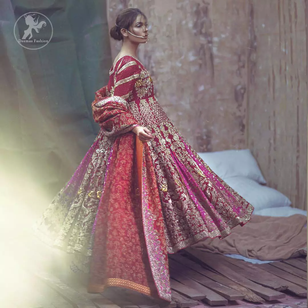 Captured in traditional silhouette, this frock bursts of vibrant colors and sumptuous details of zardozi, kora and dabka is a perfect Mehndi ensemble. The detailed kundan work on neckline and vertical panel stripes ornamented with gold kora and dabka embroidery on the bodice and comprises with churidar pajama. Complete the look with red self printed shawl and embellished pallu border to give it a perfect look.