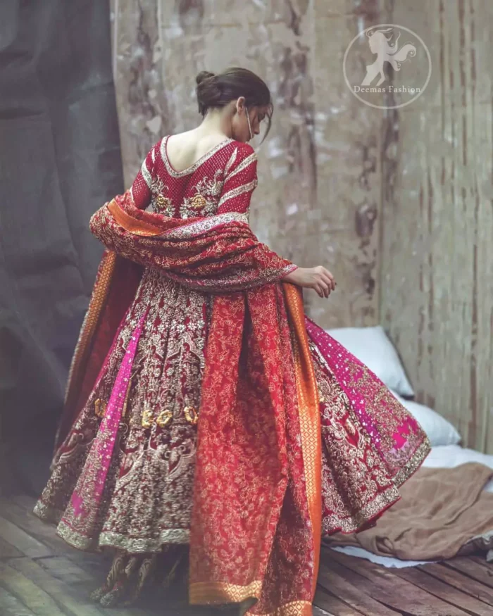 Captured in traditional silhouette, this frock bursts of vibrant colors and sumptuous details of zardozi, kora and dabka is a perfect Mehndi ensemble. The detailed kundan work on neckline and vertical panel stripes ornamented with gold kora and dabka embroidery on the bodice and comprises with churidar pajama. Complete the look with red self printed shawl and embellished pallu border to give it a perfect look.