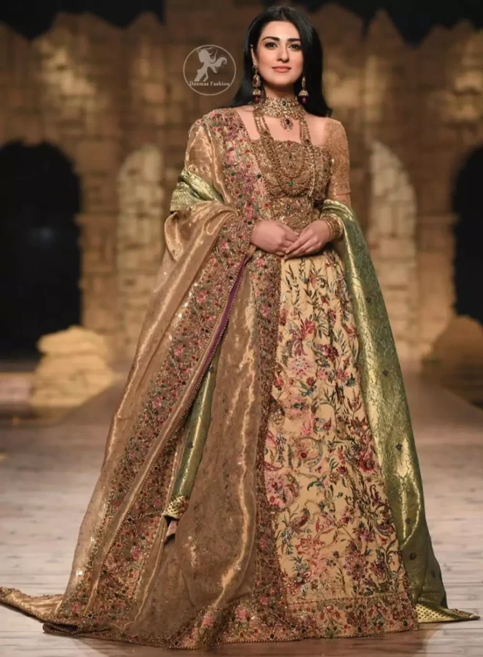 Modern yet traditional: This regal muddy waters maxi is an immensely captivating traditional piece, enhancing the art of classical heritage showcasing the craftsmanship of antique shaded kora, dabka & mukesh detailed with pearls; artistically embellished to give a beautiful rhythm to the outfit. Furthermore it is enhanced with multiple colored thread embroidery. It comes with brocade pajama. This outfit is paired with an ethereal bridal dupatta focusing on kora and dabka handwork borders on all four sides.