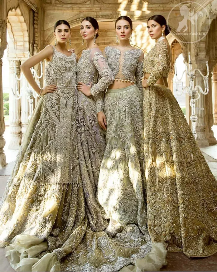 The grand gold bridal stands out due to its uniqueness and the perfect fusion of modern cut and traditional embroidery. This outfit is made of rich floral embroidery and different styles motifs which is further enhanced with zardoze work. It is highlighted with kora, dabka, tilla, sequins and pearls. Heavily embellished lehnga with embroidered motifs spread all over and finished with thick kora and dabka borders completes the look. It is coordinated with beautiful dupatta with thick matha patti border on the front and intricate beautiful border on all rest of the three sides. Furthermore it is enhanced with sprinkled sequins all over it.