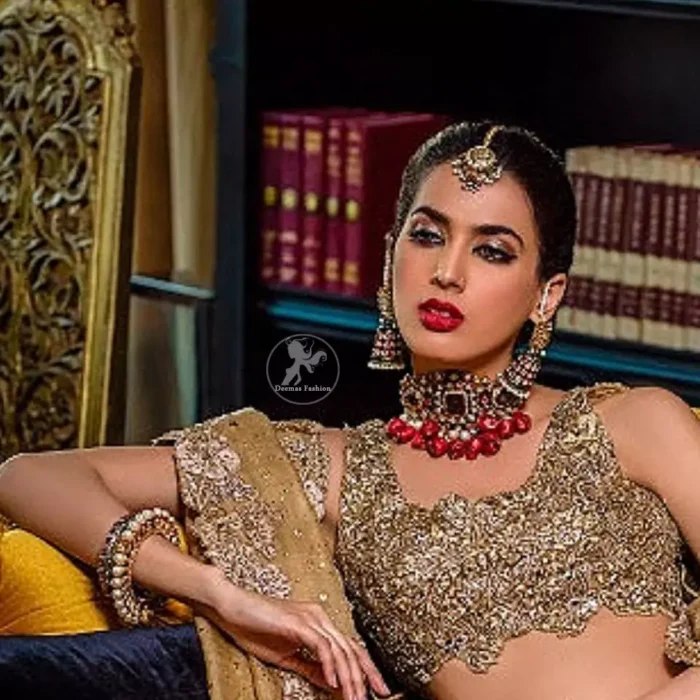This bridal dress is perfect for your special day. Blouse is beautifully decorated with floral embroidery and embellished scalloped border. It is adorned with kora, dabka, tilla, sequins and pearls. It comes with an exquisite lehengha with thick embroidered border to give it a regal look. Dupatta comprises of floral thread embroidery allured with thick embellished border