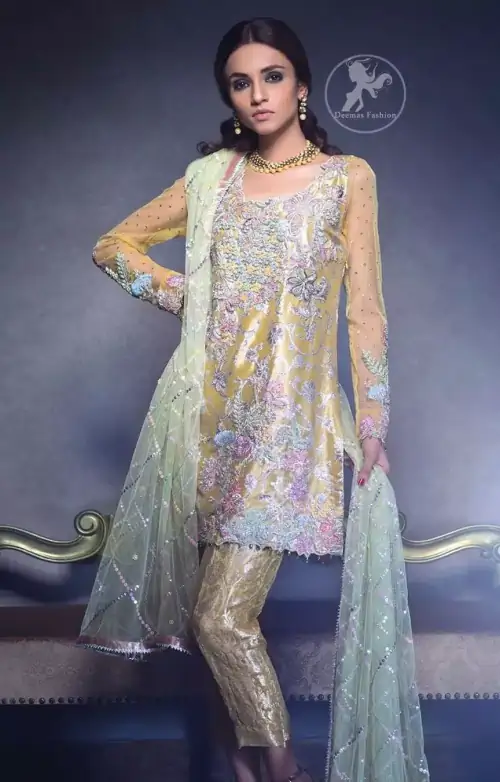 This super stunning  shirt is made of rich floral embroidery which is further enhanced with colorful gota work.  It is