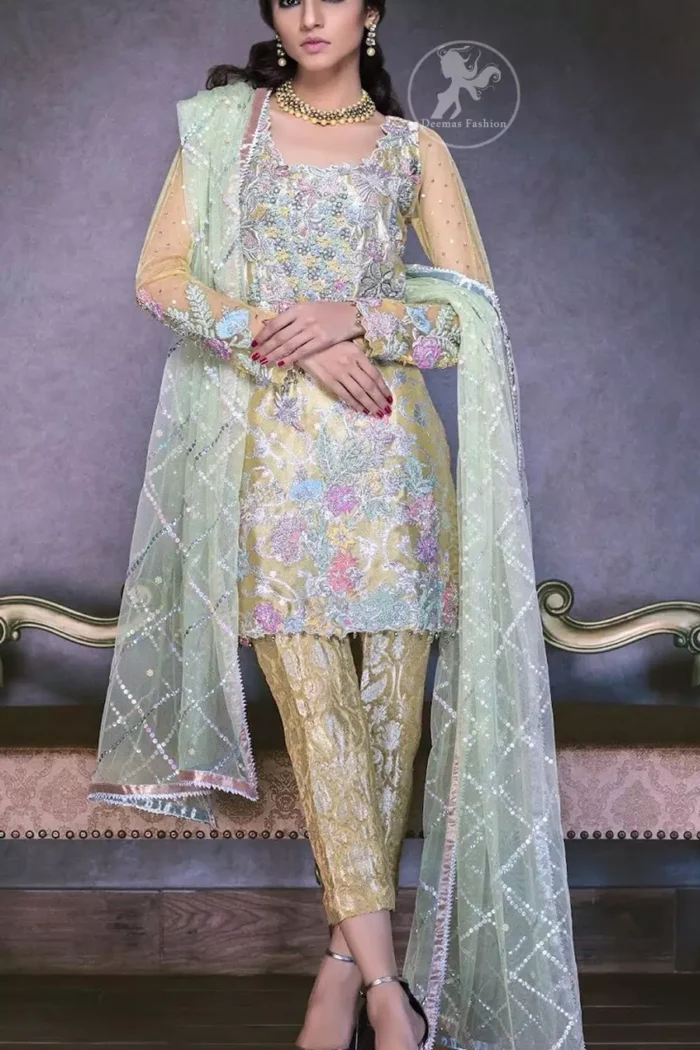 This super stunning  shirt is made of rich floral embroidery which is further enhanced with colorful gota work.  It is highlighted with gota work, sequins and pearls. The detailed scalloped border gives a perfect ending to this shirt. It comes with indian khaki trouser. It is coordinated with chiffon dupatta which is sprinkled with sequins all over it.