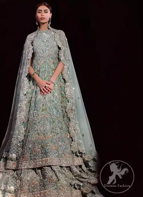 Reflecting exuberant color play in this ethereal piece meticulously highlighted with zardosi work. Heavily embellished in the front with intricate