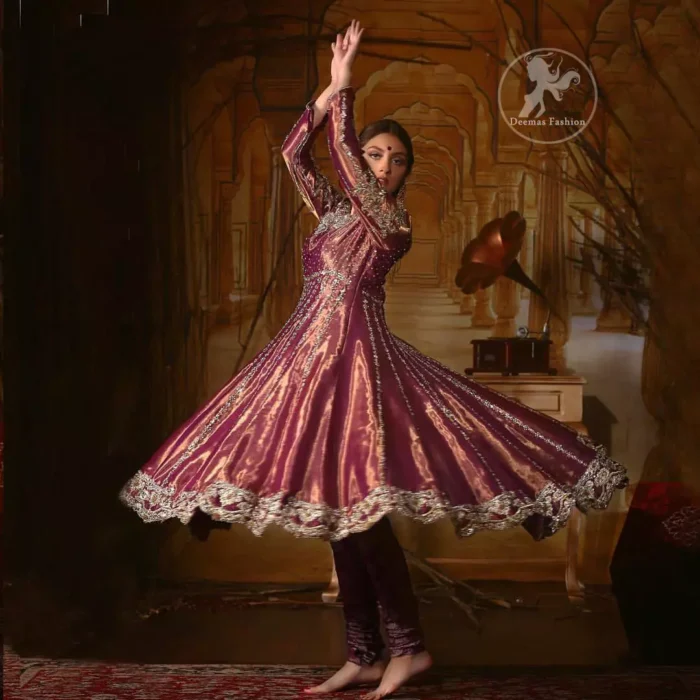 Delicately crafted and personifying chic elegance with an element of grandiose. The detailed kundan work on neckline and vertical panel stripes ornamented with silver and antique shaded kora and dabka embroidery on the neckline, the thick scalloped borders and floral bunches refined the classical look. It comes with beautifull brocade churidar oajama. It is coordinated with organza dupatta which is decorated with gota work on the ground and zardosi work on all four sides of borders.