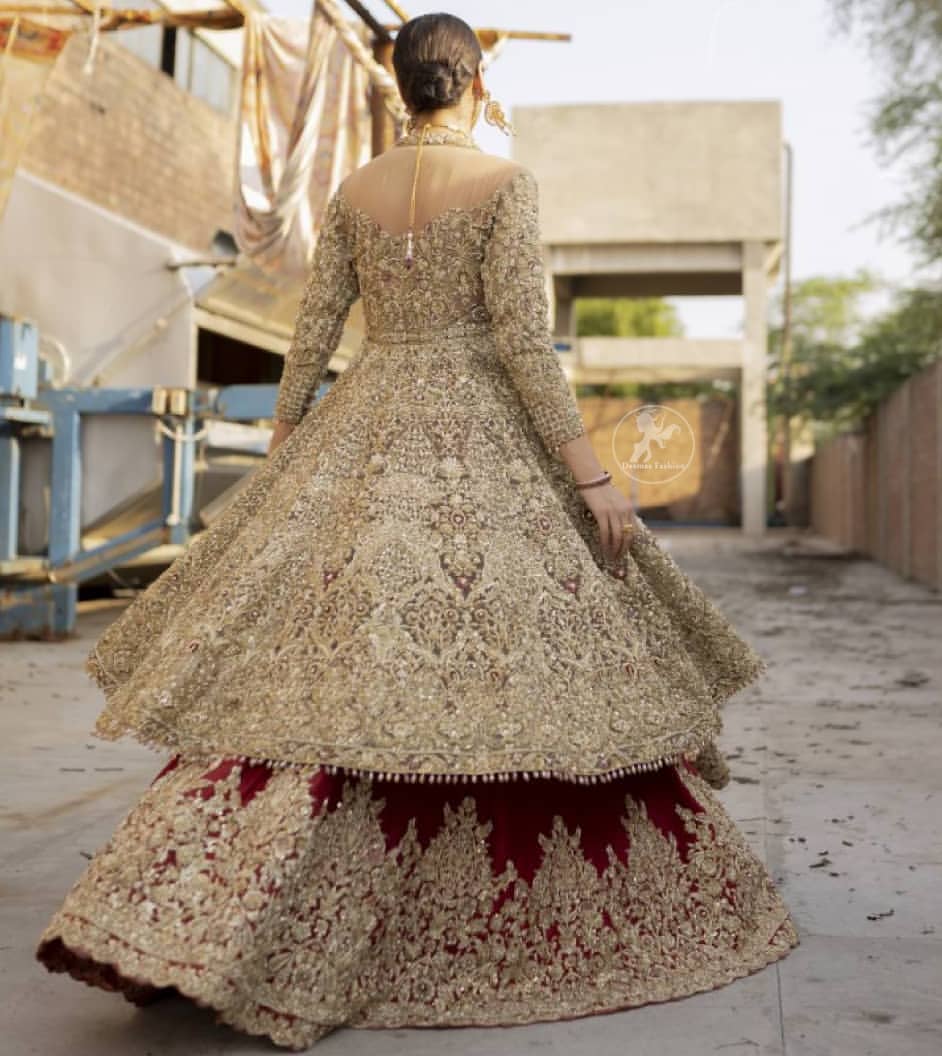 This bridal dress is perfect for your special day. Create a vision of elegance with red wine lehenga decorated with intricate gota detailing and silver gold kora dabka and sequins. Heavy embroidered frock comprises with red wine scalloped border lehenga. The outfit is coordinated with an organza dupatta with hand embroidered borders on all four sides and gota sequin work on the ground.