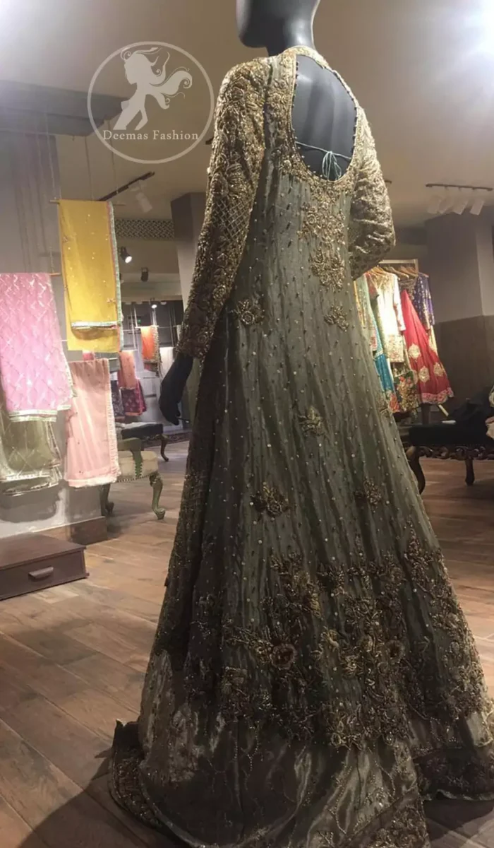 This regal regent gray outfit is an immensely captivating traditional piece, enhancing the art of classical heritage and showcasing the craftsmanship of kora, dabka & Mukesh detailed with pearls; artistically embellished to give a beautiful rhythm to the outfit. The gown is heavily embellished with antique zardosi work and floral thread embroidery. It comes with an embellished lehenga enhanced with embroidered applique on the bottom. It comes with an organza dupatta with an embellished scalloped border at all ends.
