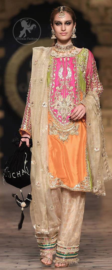 This dress is perfect for party wear due to its uniqueness and the perfect fusion of modern cut and traditional embroidery. It is beautifully decorated with heavy embroidery and the shirt is enhanced with embellished applique of two different colors. It is highlighted with kora, dabka, tilla, sequins and pearls. It comes with self printed shalwar which is enhanced with laces on bottom. It is coordinated with tissue dupatta which is sprinkled with small floral motifs all over it. It is further allured with laces all around the edges.
