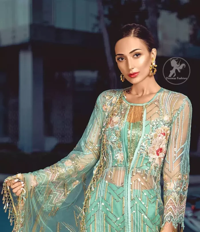 A must have creation for day to evening wear. Reflecting exuberant color play in this ethereal piece meticulously highlighted with swarovski, pearl, silver kora and dabka. It is also decorated with multiple color thread embroidery and golden tassels. It comes with full embroidered bell sleeves. This outfit is coordinated with raw silk bell bottom. The outfit comprises with tissue dupatta which is sprinkled with sequins on the ground.