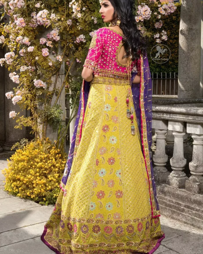 This dress is perfect for menhndi day. The shocking pink blouse is beautifully decorated with antique embroidery. It is highlighted with dull golden kora, dabka, tilla, sequins and pearls. Lehenga has small floral motifs, geometric pattern and detailed zardosi work and rich hemline. It is coordinated with purple chiffon dupatta which have verticle sequins lines all over. Furthermore it is enhanced with lace on all four sides of border.