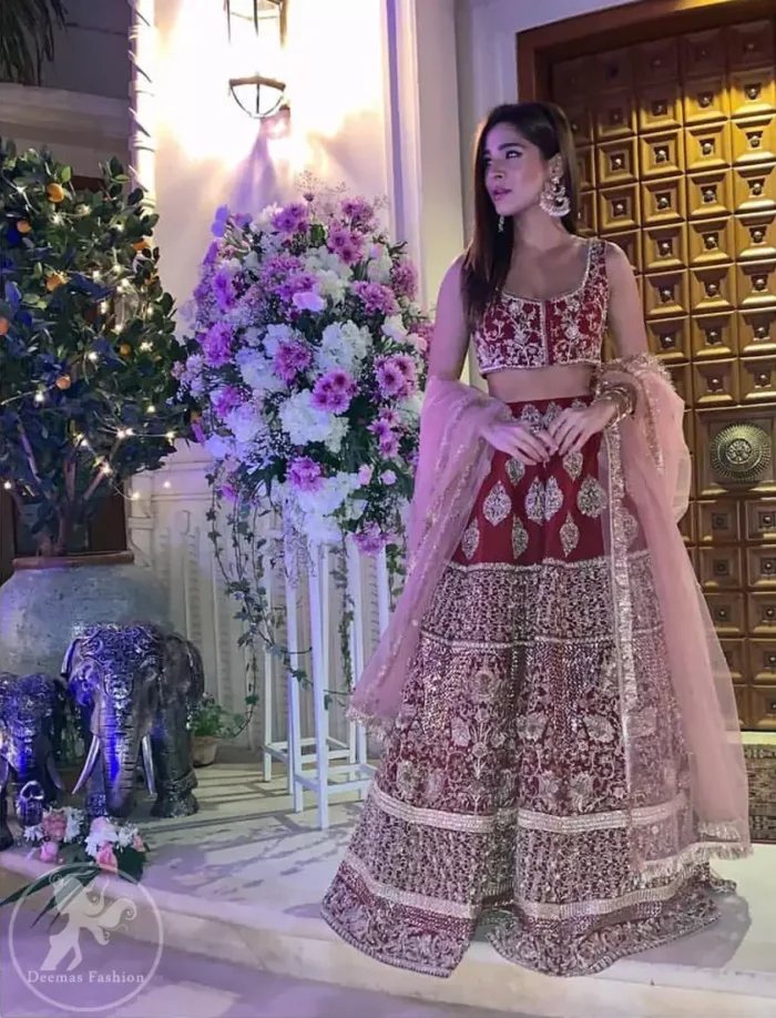 Steal the moment with our sepia brown blouse skirt emphasized with traditional embroidery and intricate floral embellishment enhanced with gold kora, dabka and sequins. It comes with heavy embellished lehenga which emphasized with different motifs and floral embroidery. It is coordinated with tissue dupatta which is sprinkled with sequins all over it.