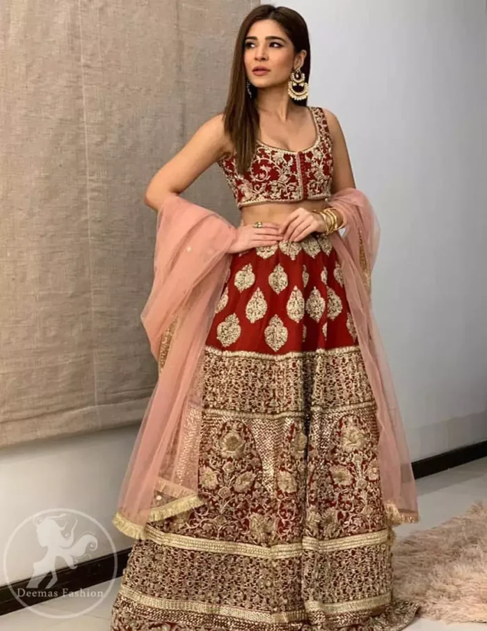 Steal the moment with our sepia brown blouse skirt emphasized with traditional embroidery and intricate floral embellishment enhanced with gold kora, dabka and sequins. It comes with heavy embellished lehenga which emphasized with different motifs and floral embroidery. It is coordinated with tissue dupatta which is sprinkled with sequins all over it.