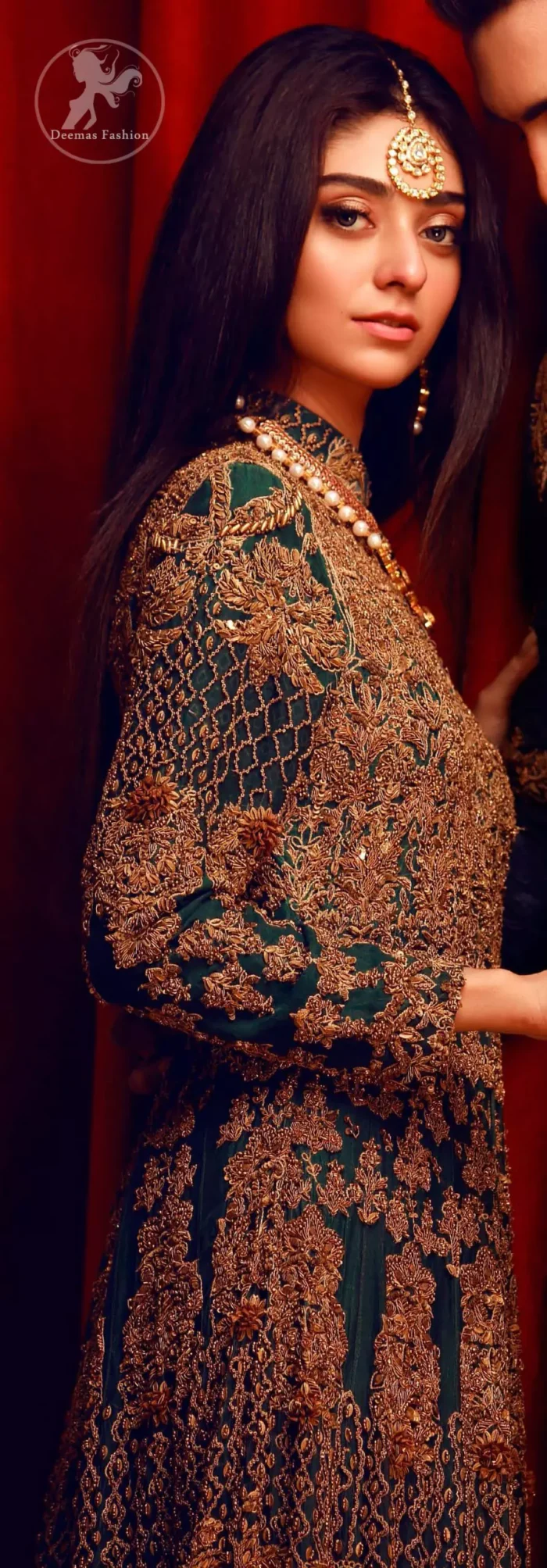 This dress is majestic beauty. Delicately crafted and personifying chic elegance with an element of grandiose. A full heavily embroidered maxi with zerdozi work details all over. Having full length sleeves adorned with motifs and geometric patterns. The bottom of the maxi is enhanced with rich floral embroidery. It comprises with churidar pajama.