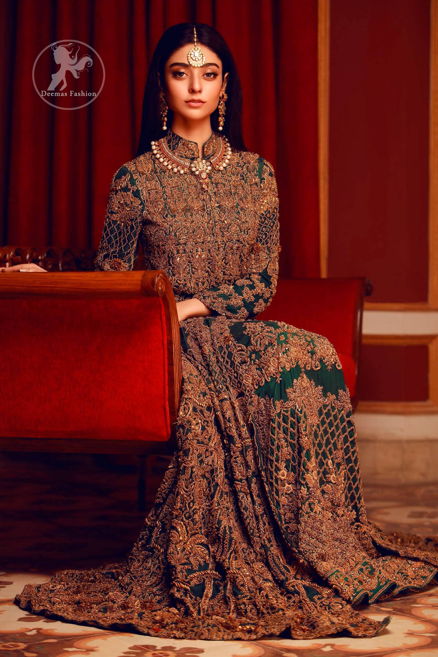 This dress is majestic beauty. Delicately crafted and personifying chic elegance with an element of grandiose. A full heavily embroidered maxi with zerdozi work details all over. Having full length sleeves adorned with motifs and geometric patterns. The bottom of the maxi is enhanced with rich floral embroidery. It comprises with churidar pajama.