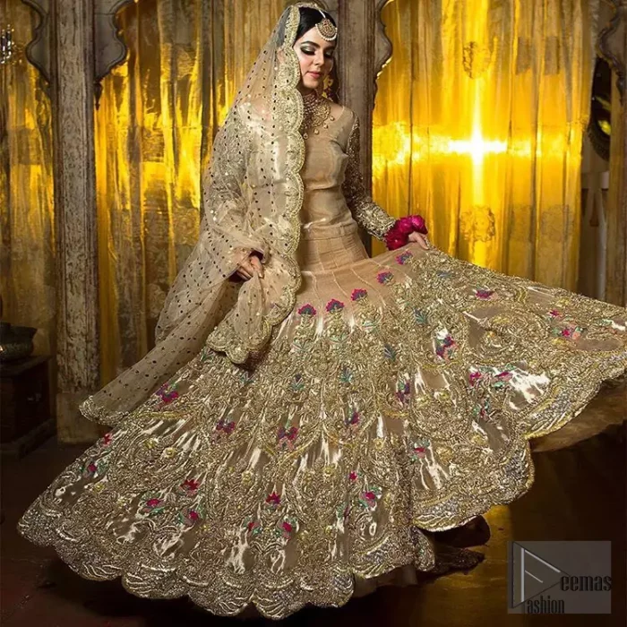 The antique brass lehenga is an example of remarkable handiwork. With a lot of attention to detail, the intricate sequencing, kora, dabka embellishment and multiple color thread embroidery makes this outfit look like nothing but a dream. The floor kissing asymmetrical lehenga add to its charm. Elegance is personified when it gets paired up with beautiful embroidered dupatta with sequins spray all over and embellished scalloped border datailing.