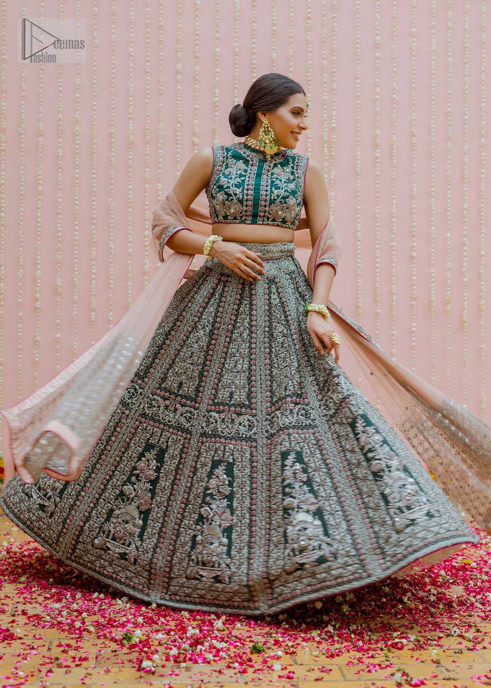 Bottle Green Velvet Blouse Lehenga Tan Dupatta. This dress is beautifully sculptured with floral embroidery, adorned with silver kora, dabka, pearl and sequins work all over.