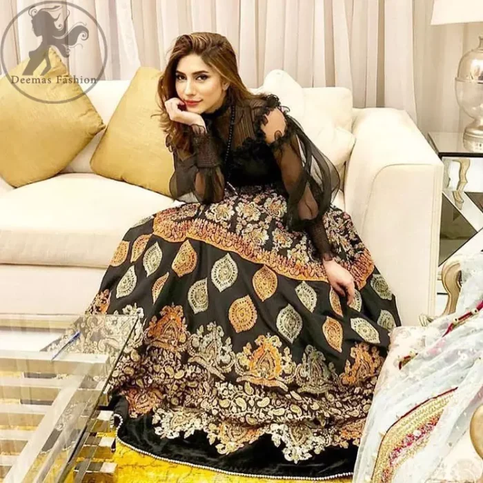 This dress is perfect for a day to evening wear. Exude elegance and class in this pishwas finessed with beautiful resham embellished daaman with floral details. It is highlighted with multiple motifs done with kora, dabka, tilla, sequins and pearls. The daman of the pishwas is adorned with black velvet having danging balls at the end. It is coordinated with tissue dupatta which is sprinkled with sequins all over it.