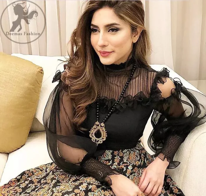 This dress is perfect for a day to evening wear. Exude elegance and class in this pishwas finessed with beautiful resham embellished daaman with floral details. It is highlighted with multiple motifs done with kora, dabka, tilla, sequins and pearls. The daman of the pishwas is adorned with black velvet having danging balls at the end. It is coordinated with tissue dupatta which is sprinkled with sequins all over it.
