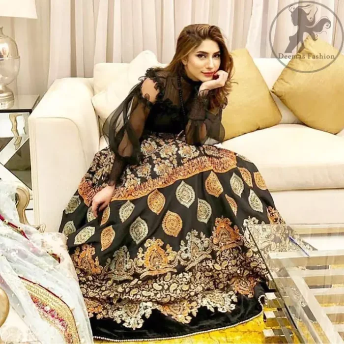 This dress is perfect for a day to evening wear. Exude elegance and class in this pishwas finessed with beautiful resham embellished daaman with floral details. It is highlighted with multiple motifs done with kora, dabka, tilla, sequins and pearls. The daman of the pishwas is adorned with black velvet having danging balls at the end. It is coordinated with tissue dupatta which is sprinkled with sequins all over it.