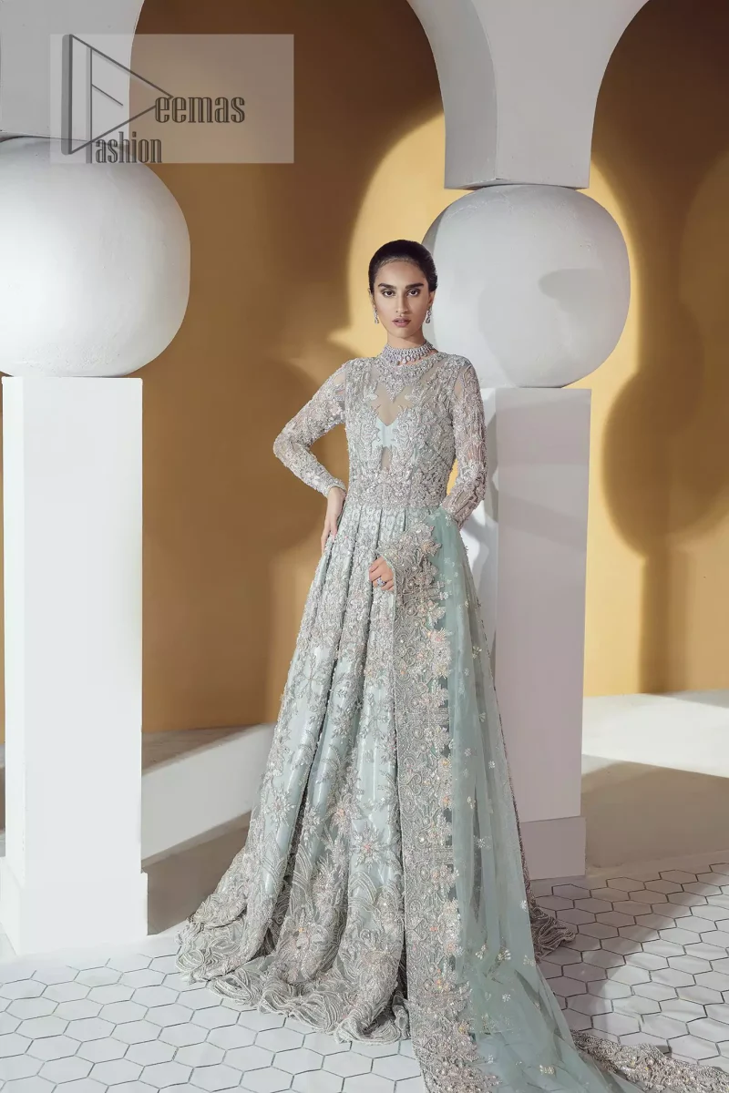 The frock is perfected with delicate golden and silver embroidery. Furthermore this shirt is made of rich floral embroidery which is enhanced with zardoze work. It is highlighted with kora, dabka, tilla, sequins and pearls. It comes with brocade churidar pajama. It is coordinated with tissue dupatta which is sprinkled with sequins all over it. It is further furnished with four sided matha patti style embellished border.