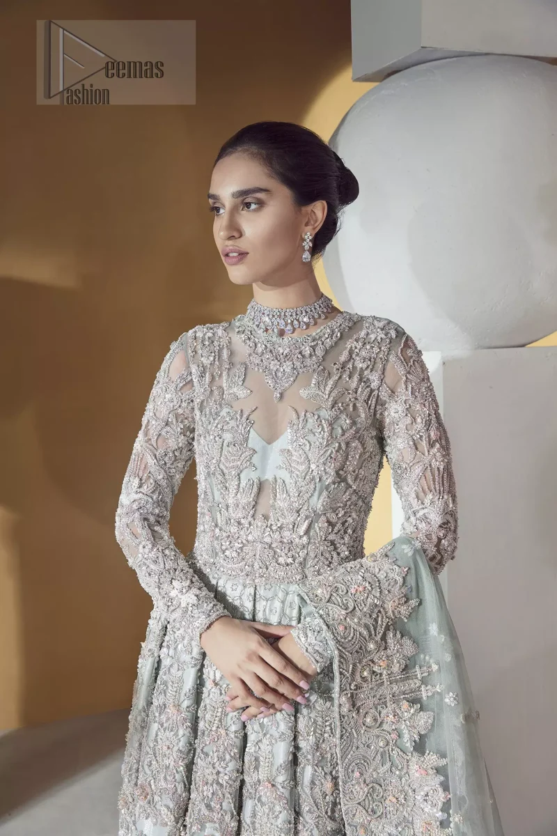 Furthermore this shirt is made of rich floral embroidery which is enhanced with zardoze work. It is highlighted with kora, dabka, tilla, sequins and pearls. It comes with brocade churidar pajama. It is coordinated with tissue dupatta which is sprinkled with sequins all over it. It is further furnished with four sided matha patti style embellished border.