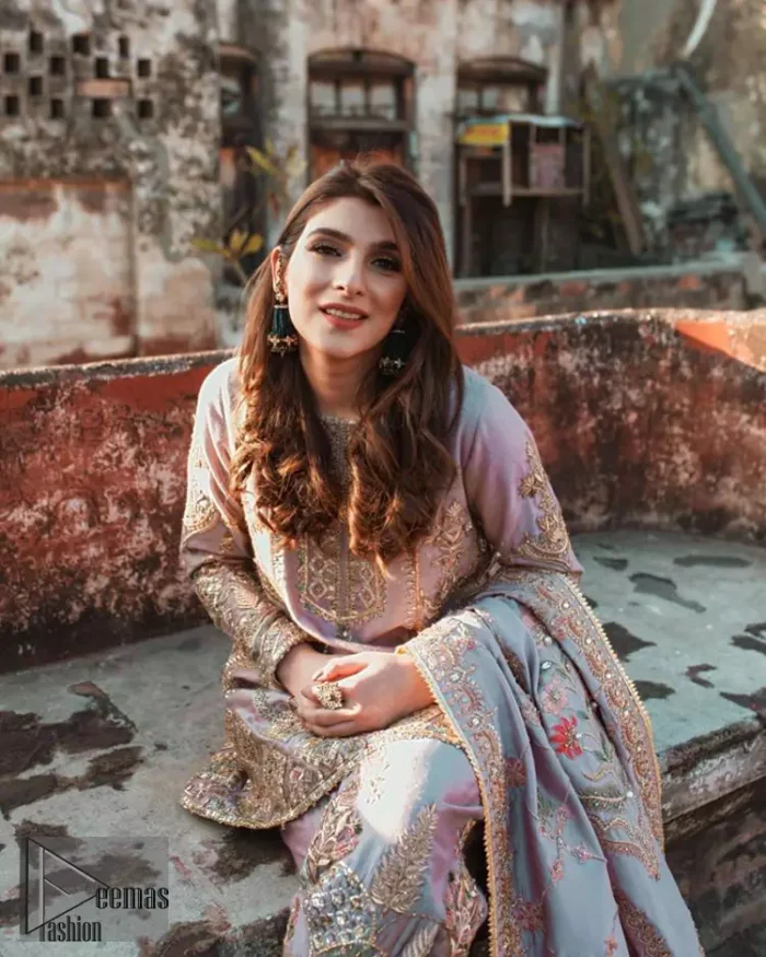 This dress is perfect for your Nikah and Engagement function. This super stunning frock is made of rich floral embroidery and geometric patterns which is further enhanced with gota work. Having full length sleeves adorned with motifs. Multiple color thread embroidery gives it a classical look. It comprises with cigarette pants ornamented with gota work and thread embroidery details. Style it confidently with raw silk fully embroidered dupatta adorned with geometric patterns and also having four sided border.