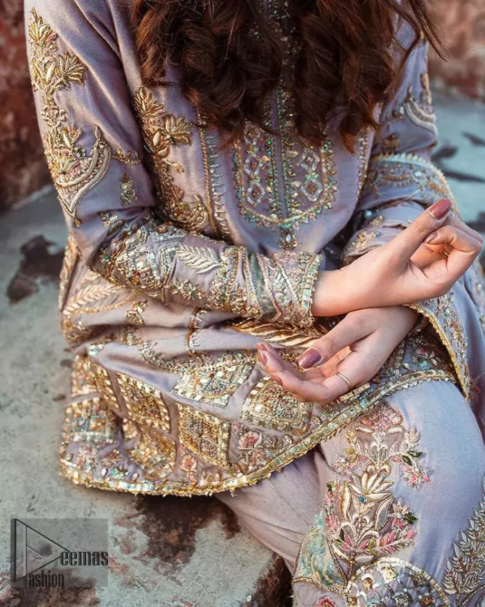 This dress is perfect for your Nikah and Engagement function. This super stunning frock is made of rich floral embroidery and geometric patterns which is further enhanced with gota work. Having full length sleeves adorned with motifs. Multiple color thread embroidery gives it a classical look. It comprises with cigarette pants ornamented with gota work and thread embroidery details. Style it confidently with raw silk fully embroidered dupatta adorned with geometric patterns and also having four sided border.
