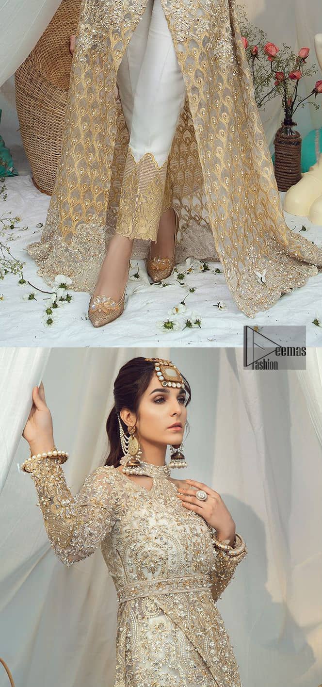 Brighten up your look with this glamorous halter neckline maxi perfect for your wedding day or evening ensemble. This glamorous attire accentuated with finest zardosi work and cut work borders. The bottom of the maxi has small circular motifs adorned with golden pearls and detailed scalp border gives a perfect ending to this maxi. Having full length sleeves ornamented with kora, dabka and tilla embroidery with sequins spray all over. Style it up with artfully coordinated ivory straight trousers finessed with organza details at the bottom.