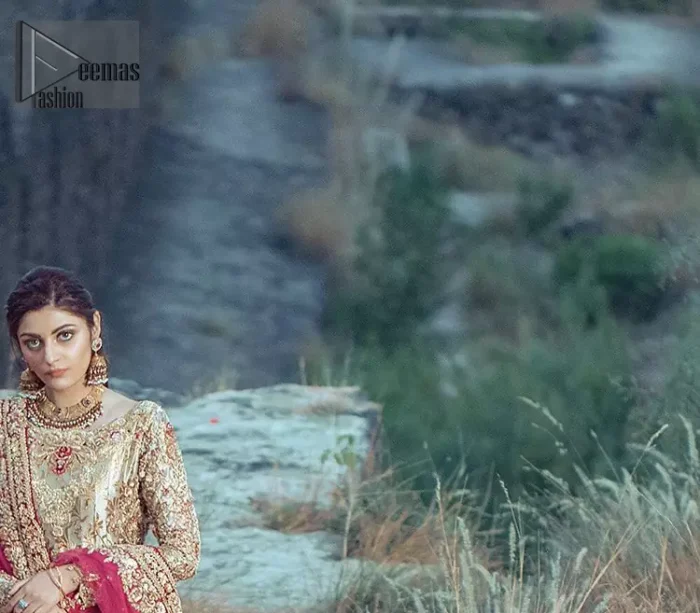 This dress is majestic beauty. A jacquard fabric maxi adorning personification of a majestic look with a contemporary silhouette showcasing the timeless art of zardosi, naqshi, kora, dabka and thread work, having full length scalloped sleeves with ethereally handcrafted golden zardosi work and resham embroidery. The bottom of the maxi is enhanced with rich floral embroidery and motifs pattern. It comprises with matching churidar pajama. The dupatta incorporates beautifully designed borders on all four sides, focusing on the heavily embellished pallu borders to give it a perfect maharani look.