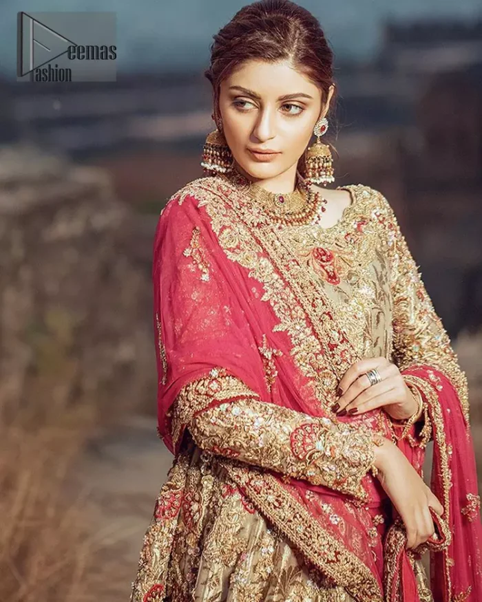 This dress is majestic beauty. A jacquard fabric maxi adorning personification of a majestic look with a contemporary silhouette showcasing the timeless art of zardosi, naqshi, kora, dabka and thread work, having full length scalloped sleeves with ethereally handcrafted golden zardosi work and resham embroidery. The bottom of the maxi is enhanced with rich floral embroidery and motifs pattern. It comprises with matching churidar pajama. The dupatta incorporates beautifully designed borders on all four sides, focusing on the heavily embellished pallu borders to give it a perfect maharani look.