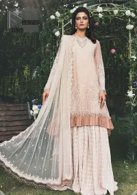 Ivory A Line Frock Sharara Net Dupatta. Go for this trendy dress, which is perfect for your nikah. Feel glamorous in our ivory a-line frock with fascinating embellishment on the neckline and silver kora, dabka, pearl, and sequins. The daman is emphasized with detailed matching embellishment and finished with a chocolate brown frill. It comprises a sharara adorned with a criss-cross pattern. This outfit is paired with a net dupatta focusing on kora and dabka handwork borders on all four sides, sequins spray all over, and finishes with tassels.