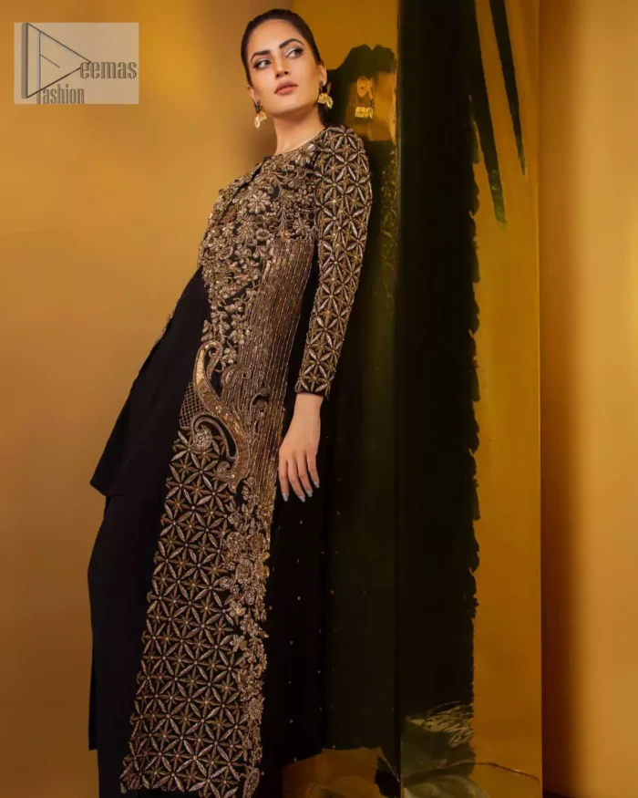 Perfected with antique gold and dark antique embellishments this black velvet ensemble is timeless masterpiece in to a chic fantasy. Delicately crafted with zardosi, kora, dabka, tilla, sequins and pearls. Furthermore it is adorned with geometric patterns all over.  Beautifully designed sleeves is an amalgamation of geometric and floral design elements. This outfit is finished with black raw silk palazzo pants and pure chiffon dupatta.