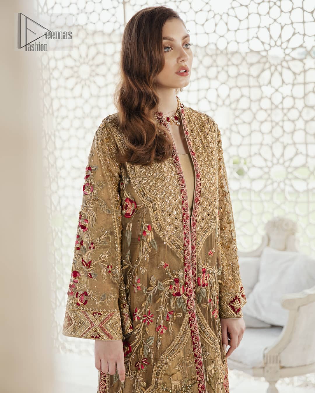 This elegant ensemble turns timeless piece into a chic fantasy. Perfect for this festive season with divine detailing of thread embroidery, color balance and well-crafted zardosi work. Furthermore it is elevated by vibrant floral motifs and red embellished slits. It comprises with self printed sharara ornamented with captivating embellished bottom. Style it up with matching organza dupatta with chann all over.