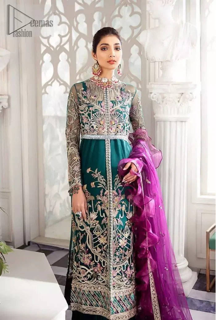  Modern yet traditional. Boost your confidence and style in this glamorous attire accentuated with finest thread work and zardosi embroidery. The outfit is beautifully sculptured with colorful embellishment and finessed with beautiful embellished applique hemline. Having full sleeves with scalloped finishing. The outfit is coordinated with crushed sharara and magenta dupatta adorned with four sided lace border and frill.