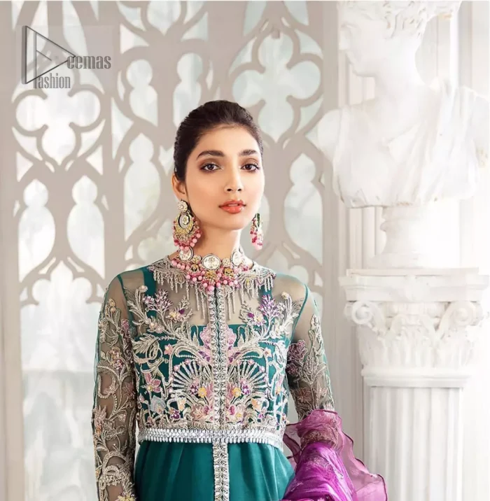  Modern yet traditional. Boost your confidence and style in this glamorous attire accentuated with finest thread work and zardosi embroidery. The outfit is beautifully sculptured with colorful embellishment and finessed with beautiful embellished applique hemline. Having full sleeves with scalloped finishing. The outfit is coordinated with crushed sharara and magenta dupatta adorned with four sided lace border and frill.