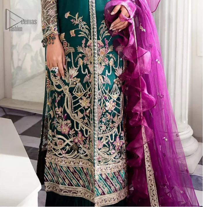  Modern yet traditional. Boost your confidence and style in this glamorous attire accentuated with finest thread work and zardosi embroidery. The outfit is beautifully sculptured with colorful embellishment and finessed with beautiful embellished applique hemline. Having full sleeves with scalloped finishing. The outfit is coordinated with crushed sharara and magenta dupatta adorned with four sided lace border and frill.