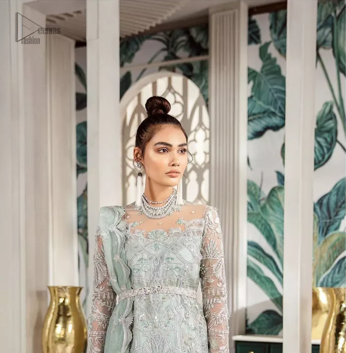 Delicately crafted and personifying chic elegance with an element of grandiose. This outfit is aesthetically designed with motifs and floral patterns, embellished with kora, dabka, nakshi, sequins, cutdana and  crystals. The detailed scalp border gives a perfect ending to this peplum. Beautifully designed sleeves is an amalgamation of floral design elements. Sharara comprises of sequins spray all over. The dupatta incorporates beautifully designed scalloped borders on all four sides and tiny floral motifs.