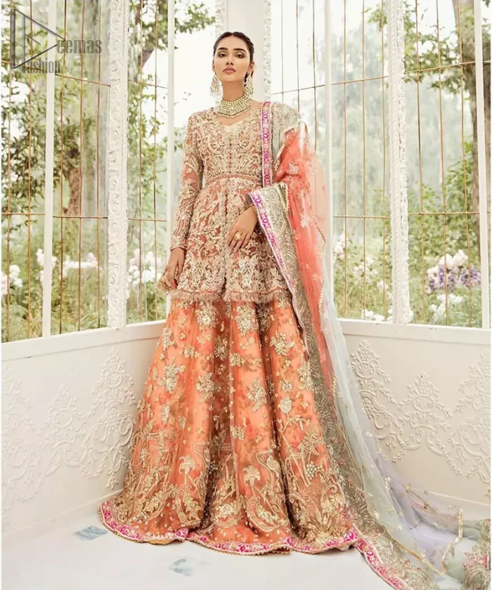 Captured in traditional silhouette, The bridal stands out due to its uniqueness and the perfect fusion of modern cut and traditional embroidery. This front open short frock is highlighted with kora, dabka, tilla, sequins and pearls. It comes with full embellished lehenga adorned with floral bunches, applique on the hemline and sequins spray all over it. It is coordinated with organza dupatta which is sprinkled with tiny floral motifs all over and a thick embellished border on all four sides with applique details.
