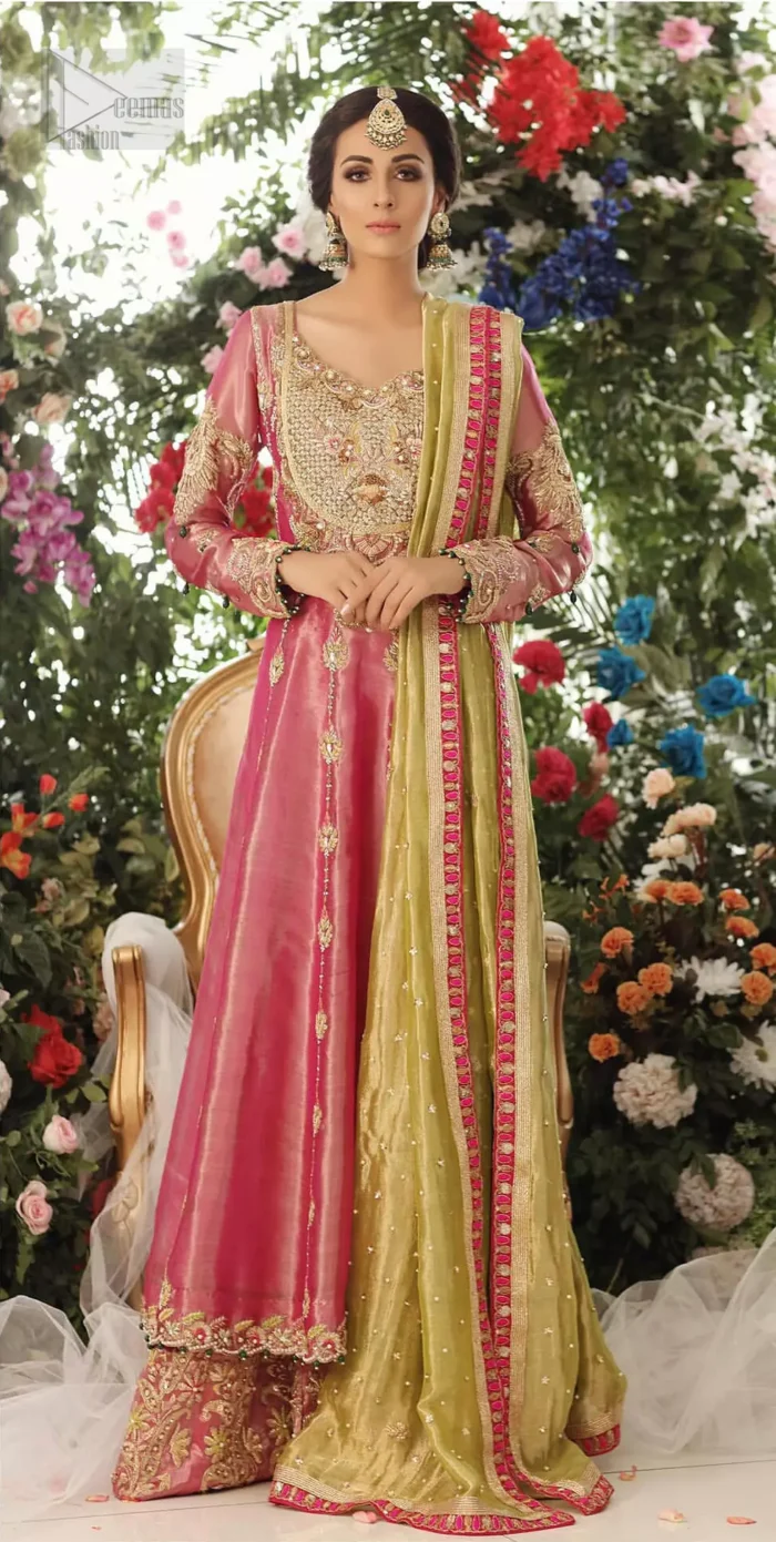 Nothing speaks of femininity and class louder than this mehndi outfits for bridesmaids. This beautiful mehndi dress comes with anarkali frock with beautiful embellished motifs around the scalloped hemline and vertically worked gold lines and heavily embellished neckline with light golden, champagne and antique shaded zardozi work. It comes with sharara adorned with colored floral embroidery with champagne embellishment. Complete the look with parrot green dupatta having four sided applique borders and sequins spray on the ground.