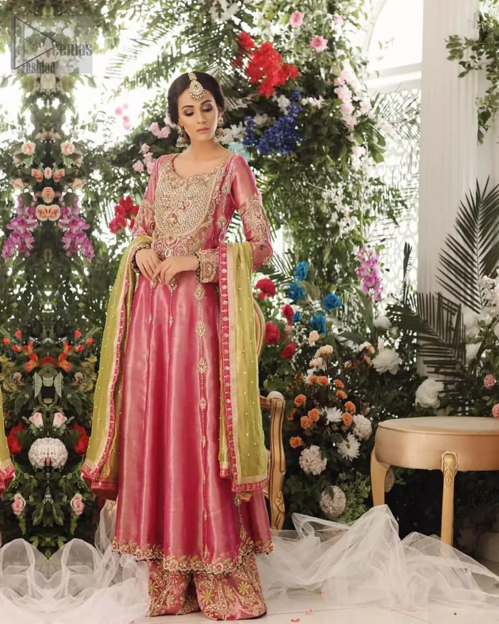 Nothing speaks of femininity and class louder than this mehndi outfits for bridesmaids. This beautiful mehndi dress comes with anarkali frock with beautiful embellished motifs around the scalloped hemline and vertically worked gold lines and heavily embellished neckline with light golden, champagne and antique shaded zardozi work. It comes with sharara adorned with colored floral embroidery with champagne embellishment. Complete the look with parrot green dupatta having four sided applique borders and sequins spray on the ground.