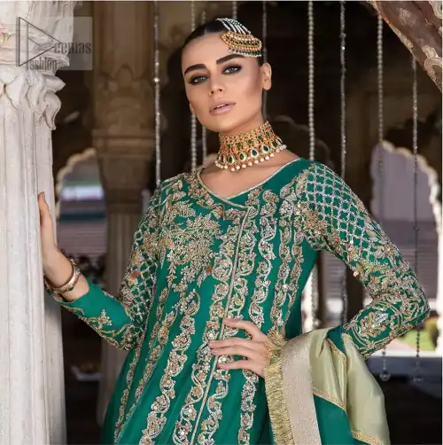 Steal the moment with our emerald green floor length angrakha emphasized with traditional neckline and intricate floral daman enhanced with