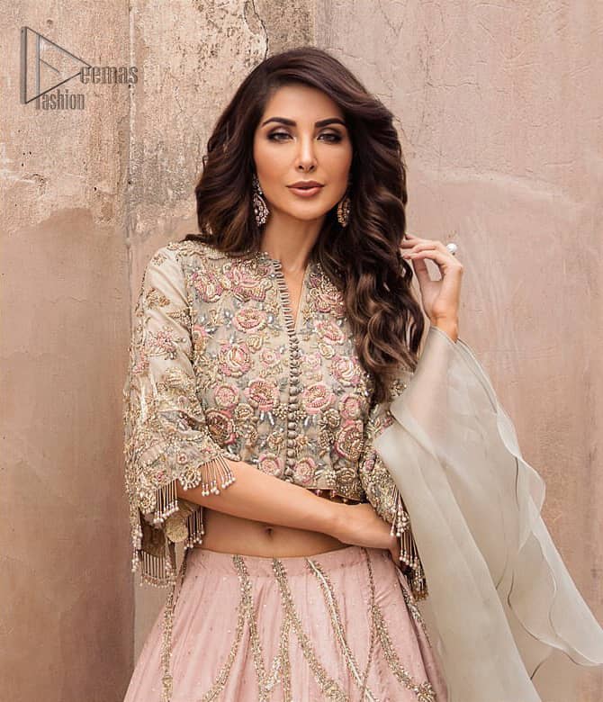 This artisanal piece is rendered in grace and timelessness. An example of beauty and elegance. Look breathtakingly stylish in this embroidered regalia furnished with intricate embroidered blouse and scalp third quarter bell sleeves. It comprises with gradient lehenga having light pink and mint green colors done with zardozi floral bootis and a thick embellished bottom. Style it up with mint green organza dupatta.