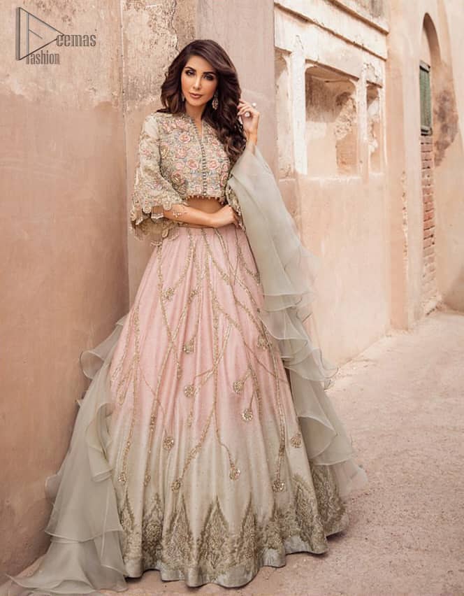 This artisanal piece is rendered in grace and timelessness. An example of beauty and elegance. Look breathtakingly stylish in this embroidered regalia furnished with intricate embroidered blouse and scalp third quarter bell sleeves. It comprises with gradient lehenga having light pink and mint green colors done with zardozi floral bootis and a thick embellished bottom. Style it up with mint green organza dupatta.