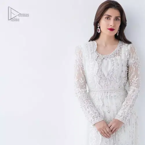 This is an ensemble that deserves to be flaunted. The ivory white shirt is an example of remarkable handiwork. With