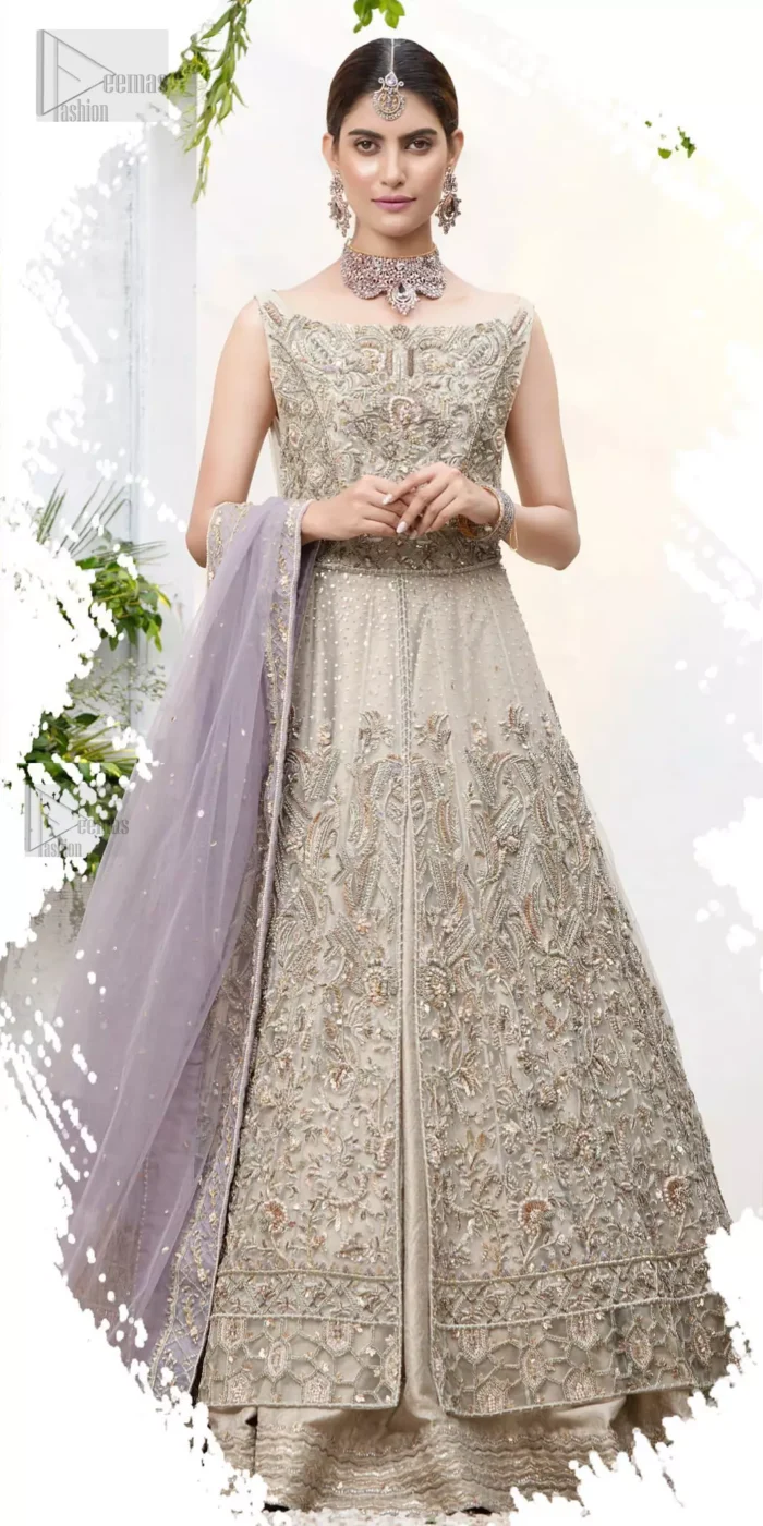 The ultimate in feminine elegance with fine detail to die for. Our bride makes a statement in this stunningly floraison, perfect blend of glamour and tradition with outstanding craftsmanship and gorgeous detailing. This front open pishwas is gorgeously decorated with floral bunches all over done with antique shaded zardozi work. It comprises with light beige jamawar lehenga with zardozi detail on the bottom. Style it up with light purple net dupatta sprinkled with sequins and four sided embellished border.