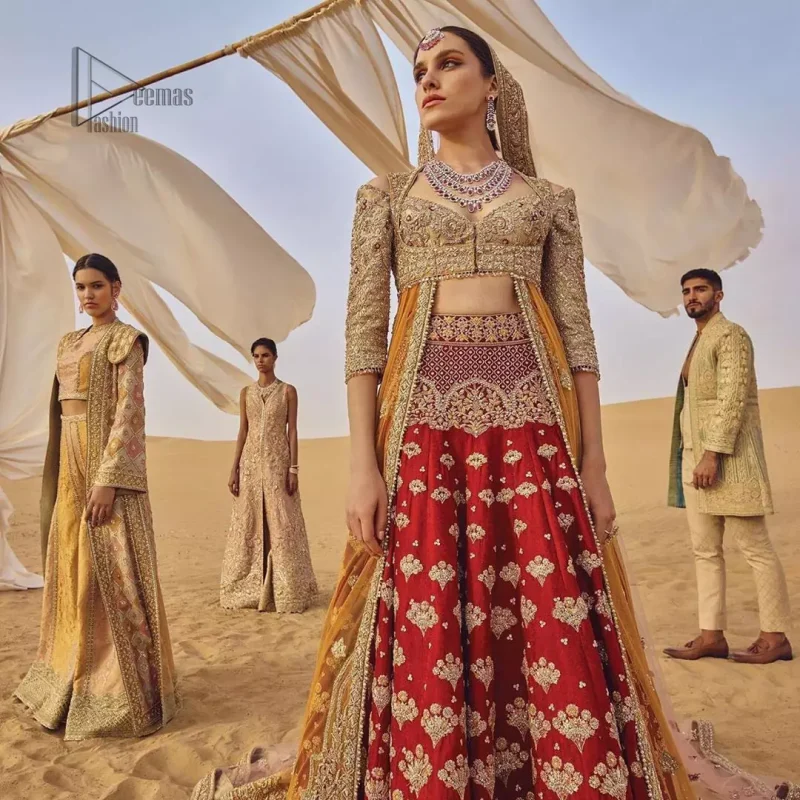 This weeding outfit makes a statement in this stunningly floraison, perfect blend of glamour and tradition with outstanding craftsmanship and gorgeous detailing. Heavily embellished blouse and bottom done with golden zardozi work and detailed central slits instantly draws attention. The lehnga with embroidered motifs spread all over and thick embellishment on lower waist. Paired it up with light pink net dupatta sprinkled with tiny motifs and four sided border.