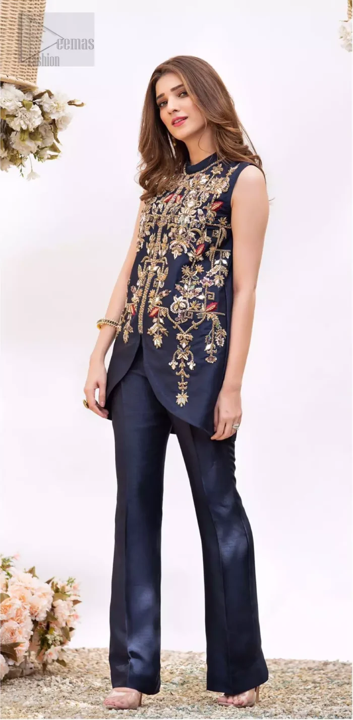 This outfit is timeless beauty. Boost your confidence and style in this glamorous attire accentuated with finest zardozi and thread work. The shirt is delicately handcrafted with golden zarozi work and multiple color thread embroidery. Style it up with navy blue bell bottom pants which complete the look.