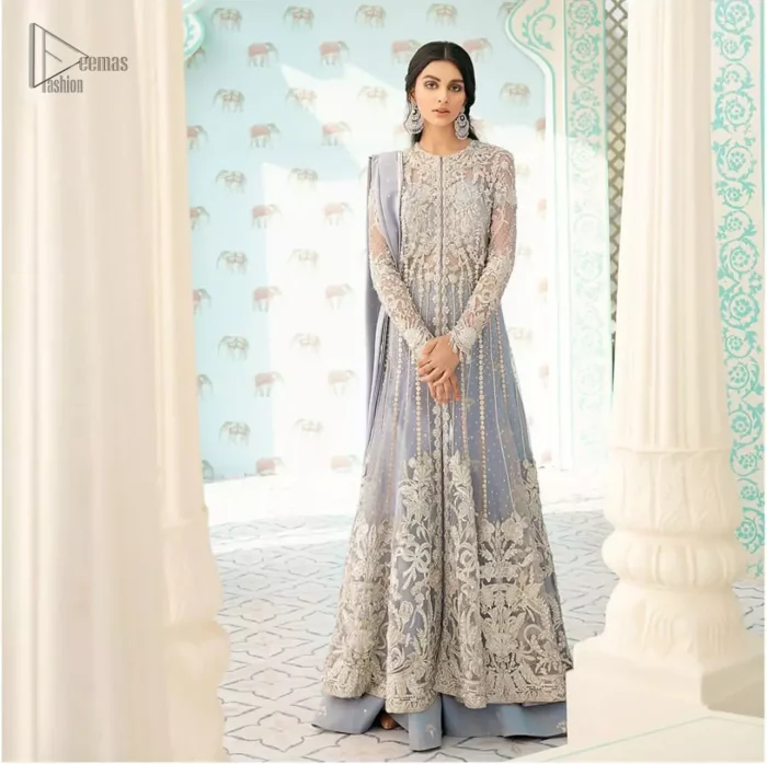You are all set to make a lasting impact with the divine royalty of this dress. This artisan piece includes intricate hand-embellishment. This technique gives this garments a unique look, and helps to sustain a traditional craft carried out by skilled artisans. This multiple panels front open maxi is ornamented by light gold zardozi work with beautiful embellished motifs around the hem and vertically worked gold lines. It comprises with raw silk sharara adorned with tiny floral motifs and dupatta is decorated with sequins spray all over.