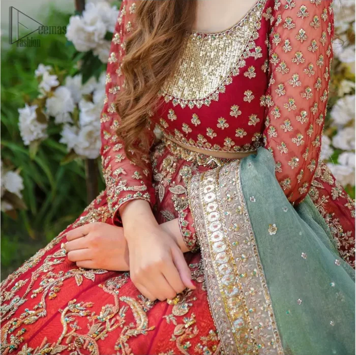 Make a special day even more magic with our exquisite bridal dress. This wedding dress is elegant and eye-catching in equal measure. Strike a breathtakingly elegant pose in this wedding dress, designed with a beautiful neckline embellished with sequins details and scattered tiny floral motifs all over. The lehenga is decorated with floral embroidery all over and finished with frilled fabric. The mint green organza dupatta with chann and finishing all around the edges makes the look complete.